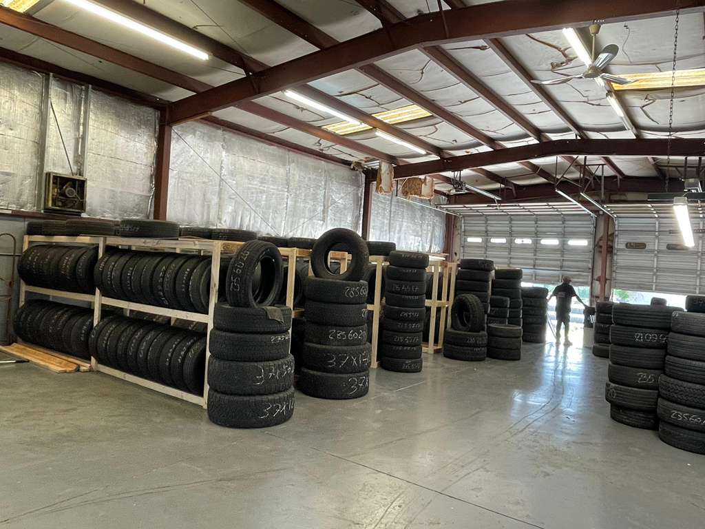Inside the Tire Brothers warehouse - racks of tires